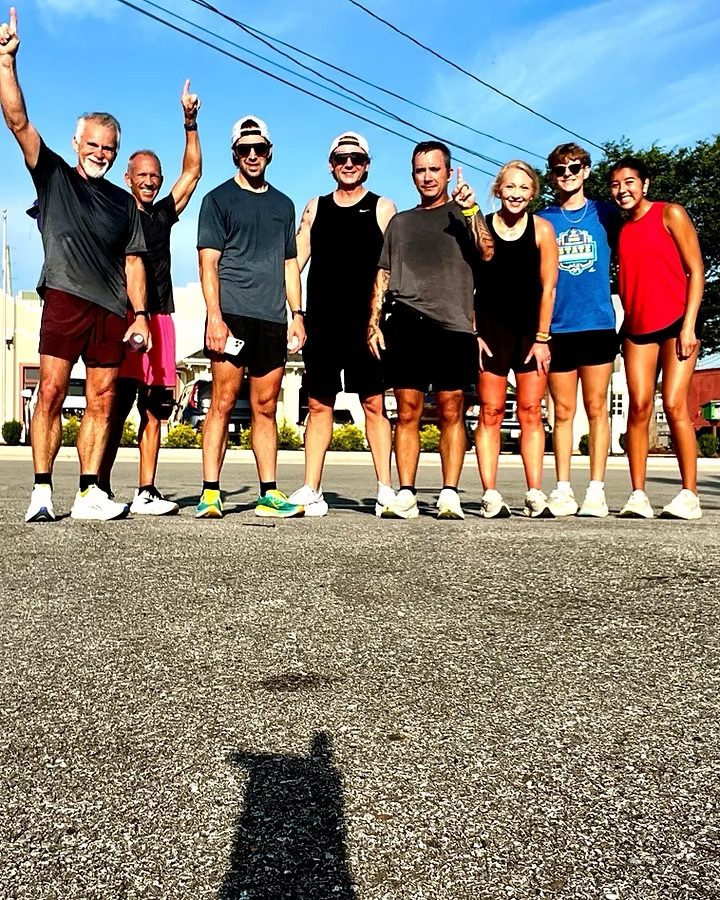 A group of friends celebrating after a run